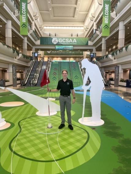 Matt stands in the lobby of the GCSAA Conference 
